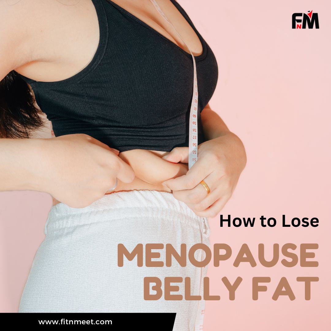 a woman measuring her belly fat
